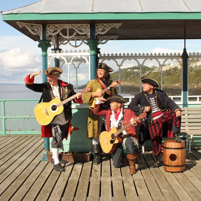 Piratitude Gallery Image. -  Piratitude - band shot gazing out to see on The Pier of the Year 2021