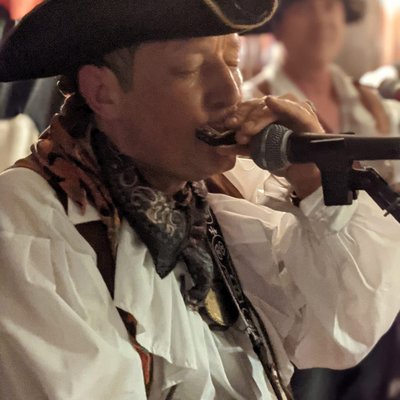 Piratitude Gallery Image. -  Lefty on Harmonica